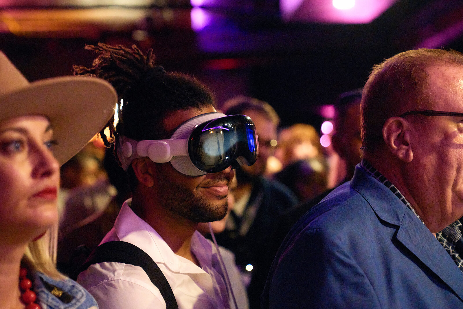 A guest in an Apple Vision Pro at The Futurist Speakeasy
